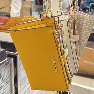 Michael Kors Jet Set Travel Large Double Zip Leather Wristlet phone holder 
NWT